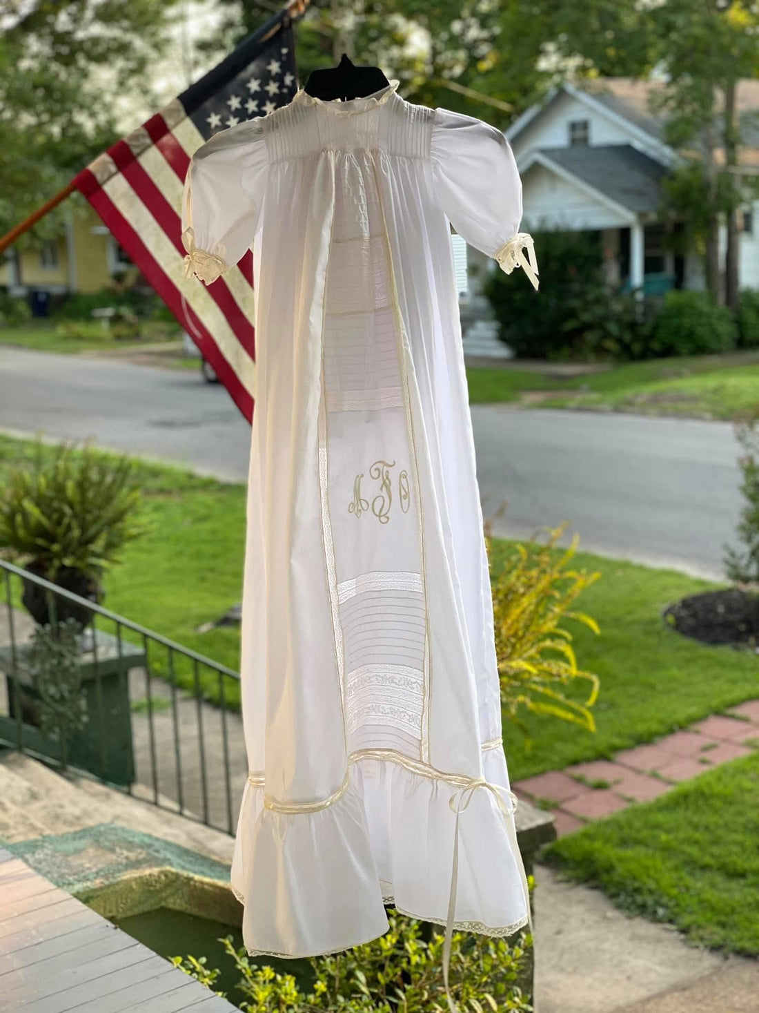 Handmade heirloom christening gown with monogram embroidery, pin tuck bodice, Swiss lace insertion, and ruffle hem, handcrafted by Gertie's Heirlooms