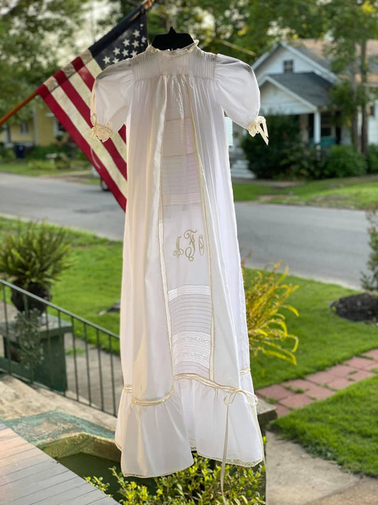 Handmade heirloom christening gown with monogram embroidery, pin tuck bodice, Swiss lace insertion, and ruffle hem, handcrafted by Gertie's Heirlooms